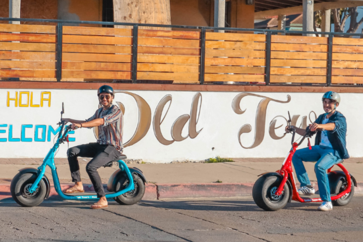 a person riding a motorcycle on the side of a road
