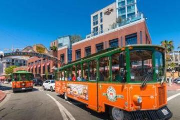 a red bus on a city street