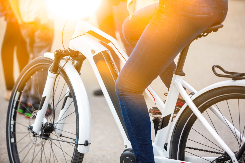 a person sitting on a bicycle