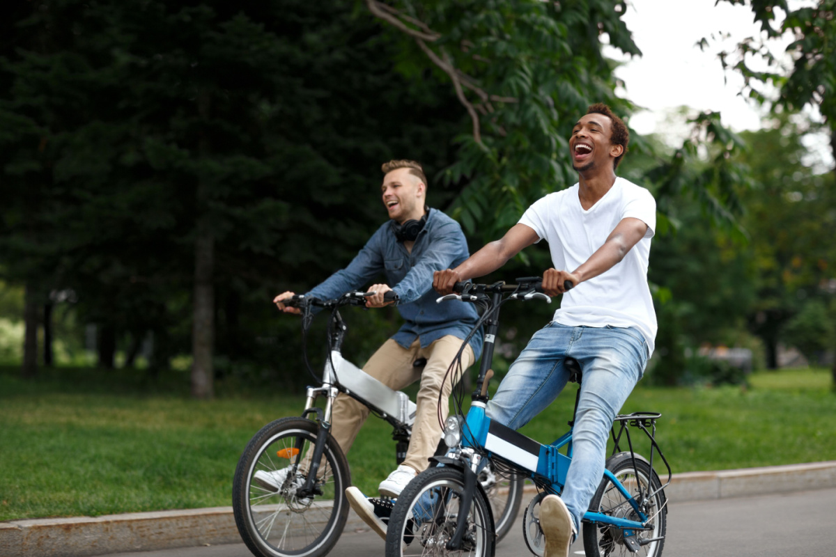 why-riding-an-electric-bike-is-good-for-your-mental-health a man riding on the back of a bicycle